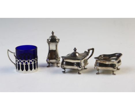 A three piece silver condiment set, Adie Brothers, Birmingham 1929 and 1931, each of quatrelobe form and raised on four paw f