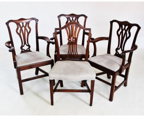 A set of four Hepplewhite style mahogany dining chairs, late 19th century, each with a pierced splat above a stuff over serpe