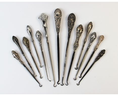 A selection of silver and white metal handled button hooks, Victorian and later (13) 