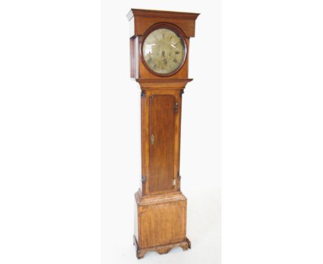 A George III oak cased thirty hour longcase clock by T M, Chesterfield, with a flat top pediment above a convex glazed door a