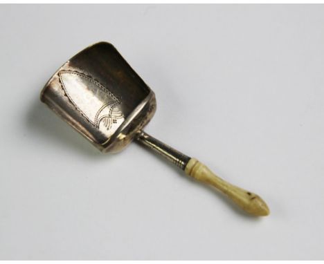 A George III silver caddy shovel, 'IT' Birmingham 1802, with turned ivory handle and shield engraving to the bowl, 7.5cm long