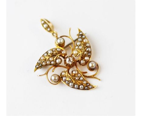 An Edwardian pearl and diamond set leaf brooch and pendant, designed as three split pearl set 'leaves' centred by an old cut 