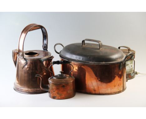 A 19th copper watering can, of tapering form with over head swing handle, 38cm high, a 19th century copper fish kettle, of ty