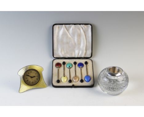 A cased set of silver gilt and enamel coffee bean spoons, Henry Clifford Davis, Birmingham 1935, (at fault) with a yellow ena