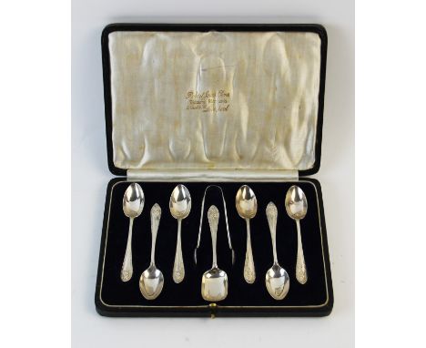 A set of six George V silver teaspoons with sugar tongs and caddy spoon, Josiah Williams &amp; Co, London 1918, to a fitted c