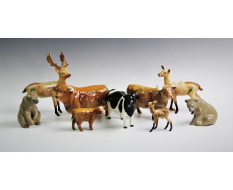 A Beswick Highland cattle trio comprising bull, cow and calf, a Beswick deer trio comprising stag, doe and faun, a Beswick mo