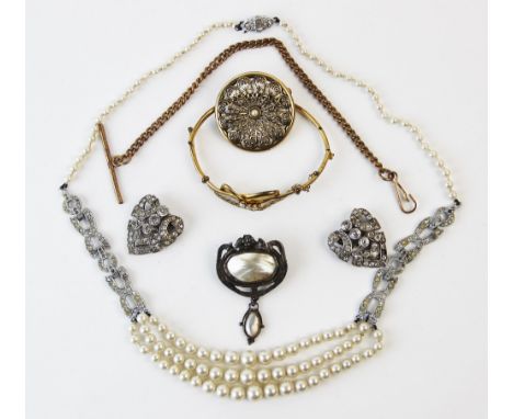 An Art Nouveau brooch, inset with a mother of pearl panel within a sinuous border surround, with further jewellery including 