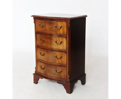 A reproduction George III style mahogany chest of drawers, 20th century, the serpentine cross banded top above four long draw