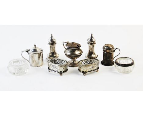 A pair of silver pepperettes, Martin Hall &amp; Co Ltd Birmingham 1938, each of waisted form and with flame finial 7.5cm high
