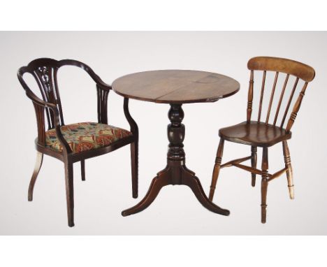 An Edwardian mahogany elbow chair, with a pierced splat back, down swept arms enclosing the serpentine seat recovered in Libe