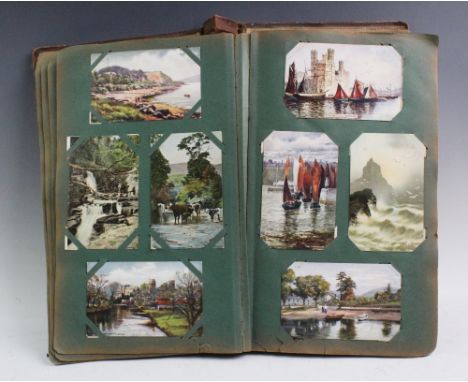A collection of Edwardian postcards to an album to include topographical interest, greetings cards to include three Louis Wai