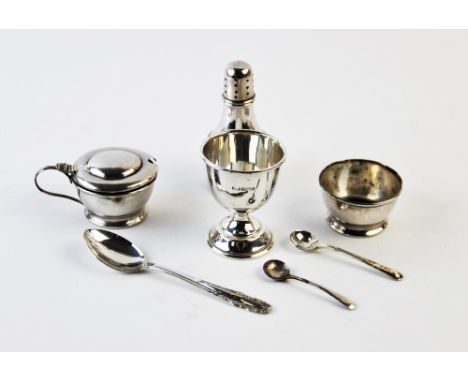 A cased silver condiment set, E J Houlston Birmingham 1922, each of cylindrical form, comprising salt, pepper and mustard, wi
