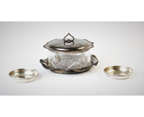 An Edwardian glass jar with silver stand and cover, William Hutton and Sons Ltd, Birmingham 1904, with beaded and cusped rim 