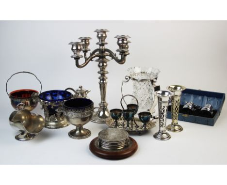 A collection of silver plated wares, to include a silver plate mounted glass vase, posy vases, a candelabrum, an egg cup stan