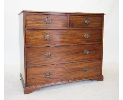 A George III mahogany chest of drawers, the rectangular moulded top above two short and three long graduated drawers, applied