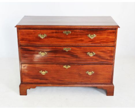 A 19th century mahogany chest of drawers, the rectangular moulded top above three cockbeaded long drawers, applied with later
