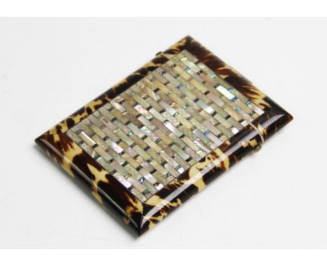 A Victorian tortoiseshell and mother of pearl inlaid calling card case, of rectangular form centrally inlaid with mother of p