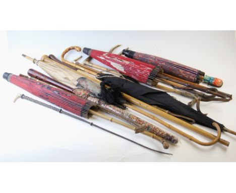 A collection of 19th century and later riding crops, parasols and canes to include, four Japanese examples, a Victorian silk 