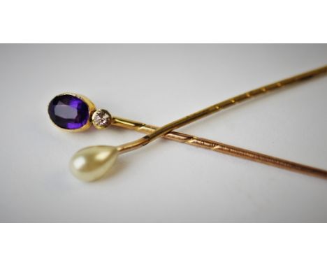 An amethyst and diamond set stick pin, an untested pearl set stick pin and a turquoise set stick pin (3) 