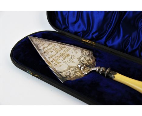 A Victorian silver plated presentation trowel with turned ivory handle, engraved inscription 'To Miss Hellawell as a souvenir