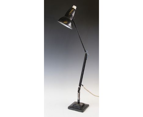 A mid 20th century black angle poise lamp, by Herbert Terry, the bell shaped metal shade with a rolled rim, supported on a sp