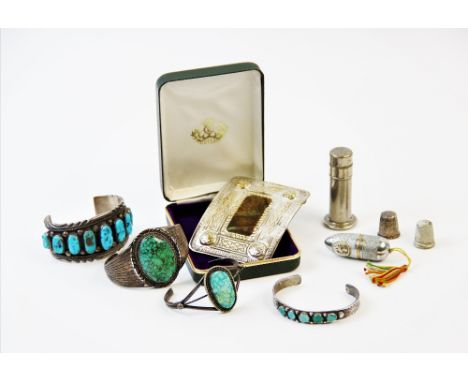 A collection of white metal jewellery, to include, a Navajo white metal bangle, by Will Denetdale, designed with central roys