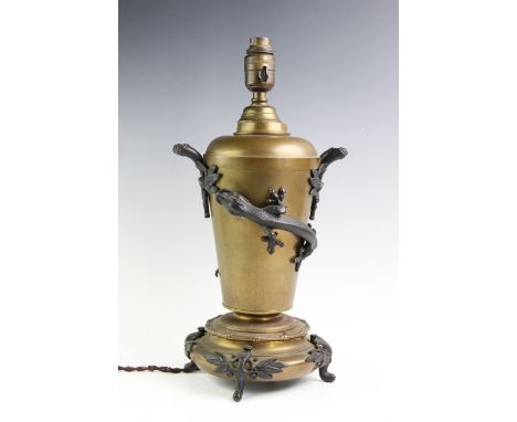 A Hicks lizard table lamp, of tapering form applied with bronzed naturalistic loop handles and a long tailed lizard, above a 