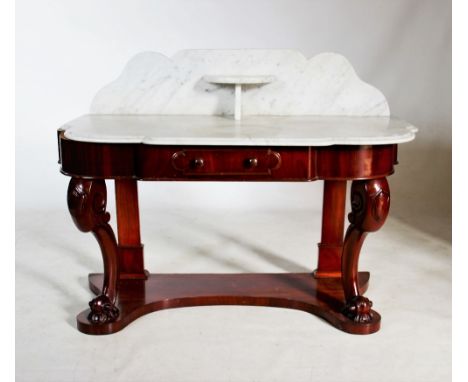 A Victorian mahogany marble top washstand, the shaped back with a central demi lune bracket shelf, above a shaped marble top 