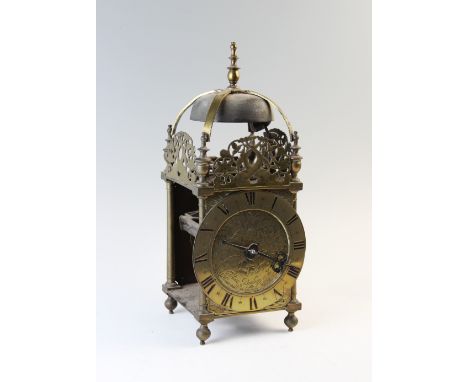 A Charles II brass lantern clock by Thomas Bagley, London, 1665 to 1666, the brass bell strap with a turned finial raised on 