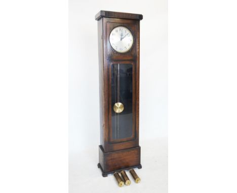 An early 20th century oak cased longcase clock, the flat top with a reeded frieze above the 28cm silvered dial, applied with 