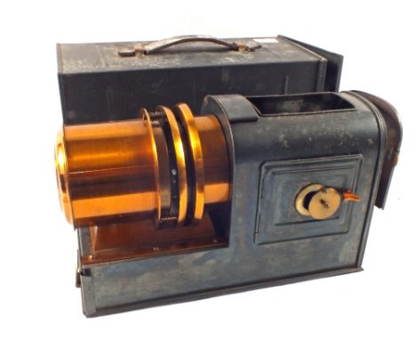 A tin cased magic lantern (outer lens missing)
