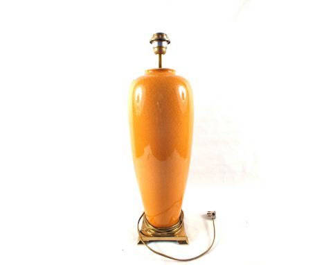 An orange crackleware glazed table lamp