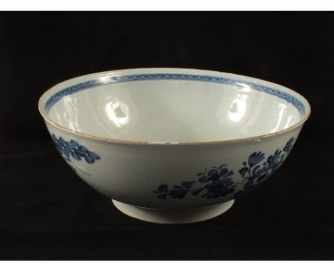 An 18th Century English Delftware blue and white bowl, body cracks, diameter 12"