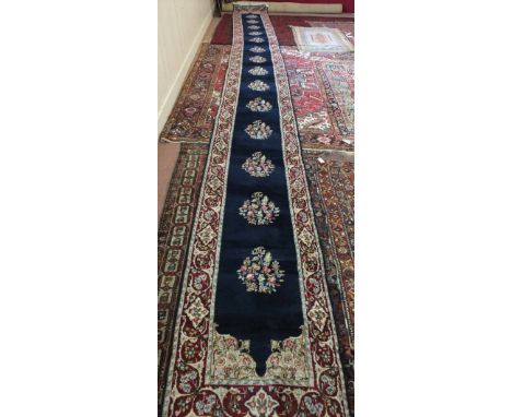 A vintage handmade Persian Kirman runner, 290" x 29"