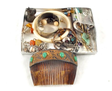 An ornate hair comb, Silver items and other pieces