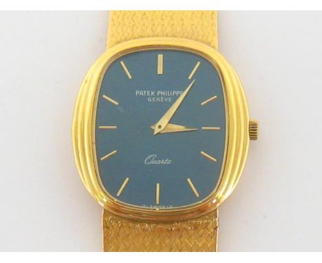 PATEK PHILIPPE, Ellipse, a gentleman’s 18 carat gold quartz wristwatch, the blued steel oblong dial with gold sword hands, on