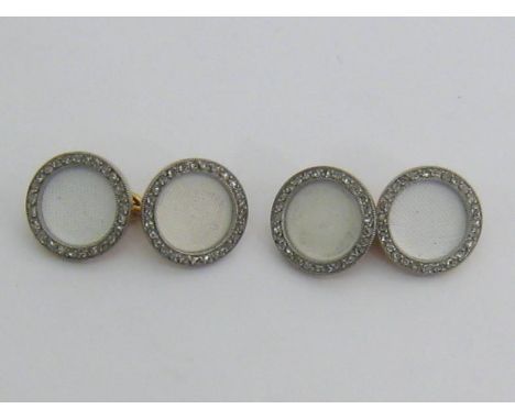 Cartier, a pair of early 20th century gold, diamond and enamel cufflinks, circa 1915, the white ‘linen’ enamel circular links