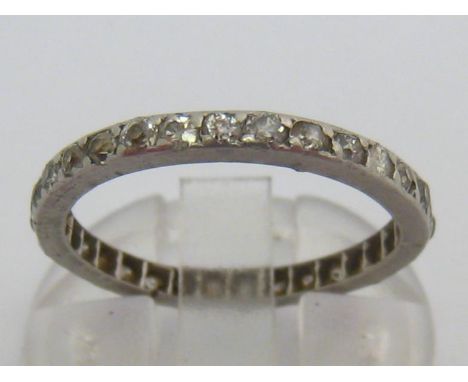 A diamond eternity ring, set with single cuts, the band 2.2mm wide, mounted in platinum, finger size K, 2.6gms