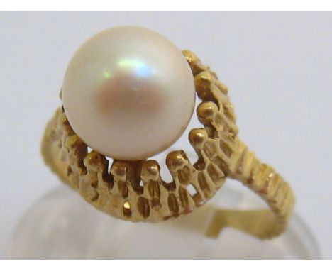 A cultured pearl ring, the single cultured pearl 7.8mm diameter, the shank stamped ‘14k’, finger size K/L, 3.3gms