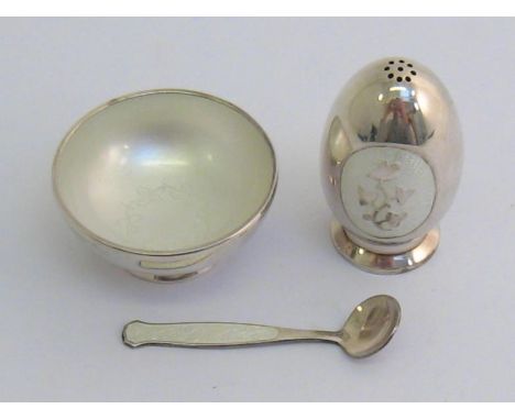 A modern Danish white metal and enamel salt and pepper, stamped “Meka Denmark Sterling”, translucent white enamel panels to e