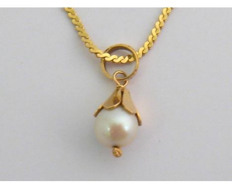 A single cultured pearl pendant, the cultured pearl 7.1mm diameter, the yellow metal bale stamped ‘750’, to a serpentine link
