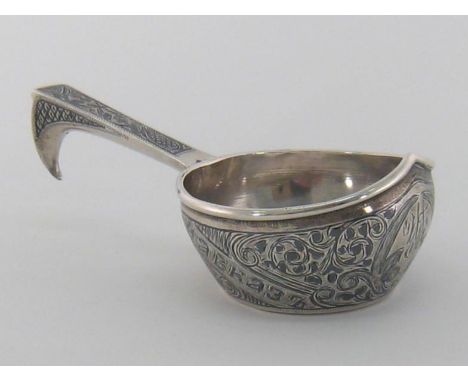 A Russian silver and niello kovsh, mark of LK (Cyrillic), Kiev, 1908/17, decorated with foliate scrolls and diagonal band wit