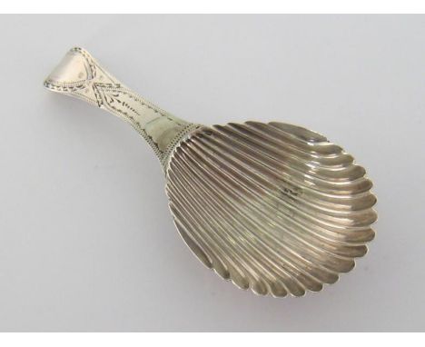 A George III silver caddy spoon with bright-engraved handle and scalloped bowl by Peter &amp; Ann Bateman, London, 1792, 9.1 