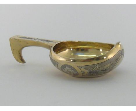 A Russian parcel-gilt silver kovsh by Ivan Kulakov, Moscow, 1872, engraved with foliate panels and floral roundels on stipple