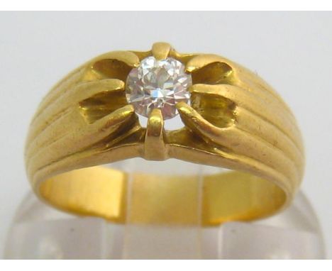 An 18 carat gold and diamond single stone ring, the central old brilliant approx. 0.25 carat, to fluted shoulders, French poi