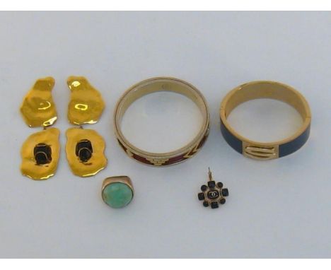 A collection of designer gilt metal costume jewellery, including a single Chanel earring, a pair of Modernist Italian earring