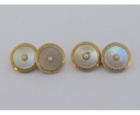 A pair of Art Deco gold, enamel, pearl and mother of pearl cufflinks, the circular links with a seep pearl to the centre (unt