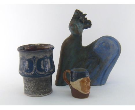Three ceramics, comprising a Danish studio pot with seed pod decoration and raku style glaze by Marianne Starck, the base wit