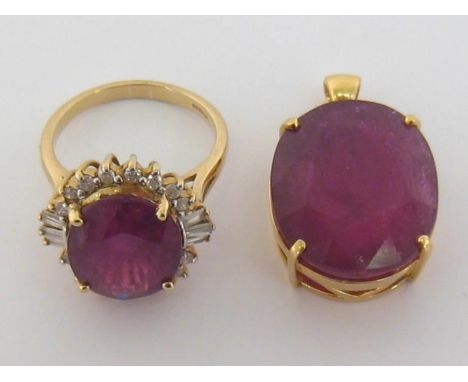 A 9 carat gold, treated ruby and diamond cluster ring, the large oval cut ruby 14.3 x 12 x 7.1, in a surround of brilliant an