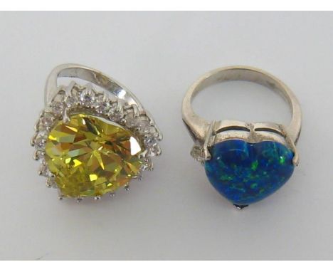 Two costume dress rings, one set with a faux opal, both mounted in white metal, stamped ‘925’ (2) 